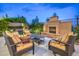 Backyard with fire pit and seating area at 3267 Royal Fortune Dr, Las Vegas, NV 89141