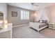 Bedroom with white bed frame and grey carpet at 3267 Royal Fortune Dr, Las Vegas, NV 89141