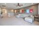 Living area with sectional sofa and access to balcony at 3267 Royal Fortune Dr, Las Vegas, NV 89141