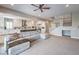 Open living room with sectional sofa and view of kitchen at 3267 Royal Fortune Dr, Las Vegas, NV 89141