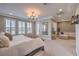 Main bedroom with sitting area and large windows at 3267 Royal Fortune Dr, Las Vegas, NV 89141