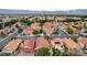 Extensive aerial view of a vibrant residential area featuring neat streets and meticulously maintained landscaping at 3320 Haven Beach Way, Las Vegas, NV 89117