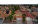 Aerial view of a house with solar panels and terracotta roof in a residential neighborhood at 3320 Haven Beach Way, Las Vegas, NV 89117