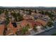 Aerial view of a house with a pool and terracotta roof in a quiet neighborhood at 3320 Haven Beach Way, Las Vegas, NV 89117