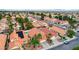 Aerial view of a house with solar panels, a pool, and a red tile roof at 3320 Haven Beach Way, Las Vegas, NV 89117