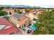 Aerial view of a tan home featuring a private pool, patio and solar panels on the roof at 3320 Haven Beach Way, Las Vegas, NV 89117