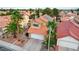 Aerial view of a two-story home showcasing its manicured lawn, desert landscaping, and attached garage at 3320 Haven Beach Way, Las Vegas, NV 89117