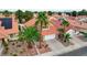 Aerial view of house with solar panels and palm trees in front at 3320 Haven Beach Way, Las Vegas, NV 89117