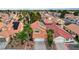 Aerial view of house with red tile roof and solar panels at 3320 Haven Beach Way, Las Vegas, NV 89117