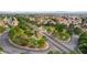 Wide aerial shot of a green park, with trees and ponds, situated in the middle of a residential neighborhood at 3320 Haven Beach Way, Las Vegas, NV 89117