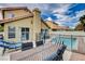 Inviting backyard showcasing a private pool, patio with ample seating, and lush landscaping at 3320 Haven Beach Way, Las Vegas, NV 89117