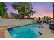 Inviting backyard oasis featuring a sparkling pool, patio furniture, and BBQ area at 3320 Haven Beach Way, Las Vegas, NV 89117