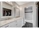 Bathroom with double vanity, marble countertop, and large mirrors at 3320 Haven Beach Way, Las Vegas, NV 89117