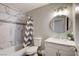 Clean bathroom, featuring a shower/tub combo and modern vanity at 3320 Haven Beach Way, Las Vegas, NV 89117