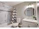 Bright bathroom featuring a marble shower, modern vanity with marble countertop, and updated fixtures at 3320 Haven Beach Way, Las Vegas, NV 89117