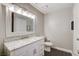 Updated bathroom with marble vanity and white cabinetry at 3320 Haven Beach Way, Las Vegas, NV 89117