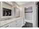 Modern bathroom with double sinks, large mirror, and tub-shower combo at 3320 Haven Beach Way, Las Vegas, NV 89117