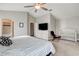 Spacious bedroom with vaulted ceiling, flatscreen TV, crib, and attached bathroom at 3320 Haven Beach Way, Las Vegas, NV 89117
