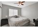 Spacious bedroom with king-size bed and ceiling fan at 3320 Haven Beach Way, Las Vegas, NV 89117