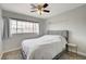 Spacious bedroom with queen-size bed and ceiling fan at 3320 Haven Beach Way, Las Vegas, NV 89117