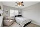 Cozy bedroom with a comfy chair and ceiling fan at 3320 Haven Beach Way, Las Vegas, NV 89117