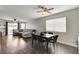 Dining room with dark wood table and six chairs, hardwood floors at 3320 Haven Beach Way, Las Vegas, NV 89117