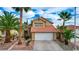 Two-story house with Spanish tile roof, landscaped yard, and two-car garage at 3320 Haven Beach Way, Las Vegas, NV 89117