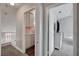 Hallway with neutral walls offering access to storage and bedrooms at 3320 Haven Beach Way, Las Vegas, NV 89117