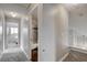 Hallway leading to a bathroom and bedroom in neutral tones at 3320 Haven Beach Way, Las Vegas, NV 89117