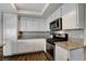 Bright kitchen featuring granite counters, stainless appliances, and ample white cabinetry at 3320 Haven Beach Way, Las Vegas, NV 89117
