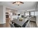 Open living and dining area with hardwood floors and fireplace at 3320 Haven Beach Way, Las Vegas, NV 89117