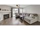 Cozy living room with fireplace and sliding glass doors leading to a backyard patio at 3320 Haven Beach Way, Las Vegas, NV 89117