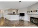 Open-concept living area featuring fireplace and view of the kitchen at 3320 Haven Beach Way, Las Vegas, NV 89117