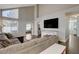 Spacious living room featuring hardwood floors, large windows, and an open floor plan at 3320 Haven Beach Way, Las Vegas, NV 89117