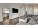 Bright living room features modern decor and provides easy access to the kitchen and the stairway to the upper floors at 3320 Haven Beach Way, Las Vegas, NV 89117