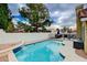 Private backyard pool with waterfall feature and patio area perfect for relaxing and entertaining at 3320 Haven Beach Way, Las Vegas, NV 89117