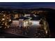 Luxury home with modern design, night view, and mountain backdrop at 37 Reflection Shores Ln, Henderson, NV 89011