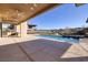 Luxury backyard with a glistening pool, built-in BBQ, and mountain views at 37 Reflection Shores Ln, Henderson, NV 89011