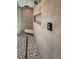 Modern bathroom featuring dual shower heads, a shower seat, and pebble stone flooring at 37 Reflection Shores Ln, Henderson, NV 89011