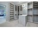 Large walk-in closet with custom shelves, drawers, and accent lighting at 37 Reflection Shores Ln, Henderson, NV 89011