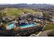 Aerial view of the community featuring a clubhouse and swimming pool at 37 Reflection Shores Ln, Henderson, NV 89011