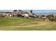 Golf course and club house view with mountains in the background at 37 Reflection Shores Ln, Henderson, NV 89011
