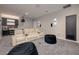 Modern home theater features comfortable seating, projector and adjacent wet bar and popcorn machine at 37 Reflection Shores Ln, Henderson, NV 89011