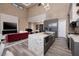 Modern kitchen with large island and high ceilings at 37 Reflection Shores Ln, Henderson, NV 89011