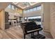 Spacious living room with grand piano, high ceilings, and open floor plan at 37 Reflection Shores Ln, Henderson, NV 89011