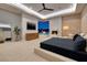 Spacious main bedroom features a fireplace, TV and glass doors leading to the pool at 37 Reflection Shores Ln, Henderson, NV 89011