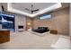 Light-filled main bedroom with fireplace, custom lighting, and access to the outdoors at 37 Reflection Shores Ln, Henderson, NV 89011