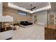 Relax in this expansive bedroom with a fireplace, TV, and ample seating at 37 Reflection Shores Ln, Henderson, NV 89011