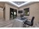 Contemporary office space featuring brick accent wall and unique aluminum desk at 37 Reflection Shores Ln, Henderson, NV 89011