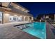Inviting pool with waterfall features and a spacious deck perfect for entertaining at 37 Reflection Shores Ln, Henderson, NV 89011